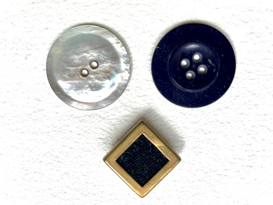 Three vintage buttons